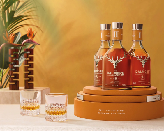 three dalmore whiskey bottles